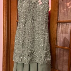 Elegant mirrorwork Sleeveless Indian party suit with palazzo bottoms.